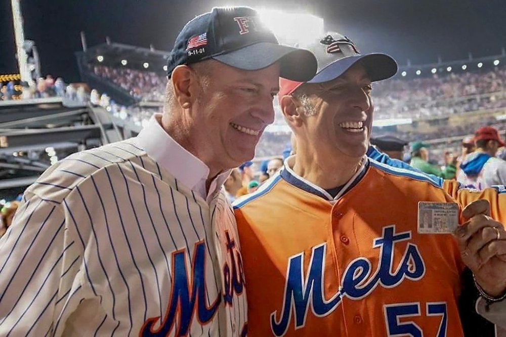 In this undated image, former New York City Mayor Bill de Blasio, left, poses for a photo with Bill DeBlasio, a wine importer from Long Island, at a New York Mets baseball game in New York. (William W. DeBlasio via AP)