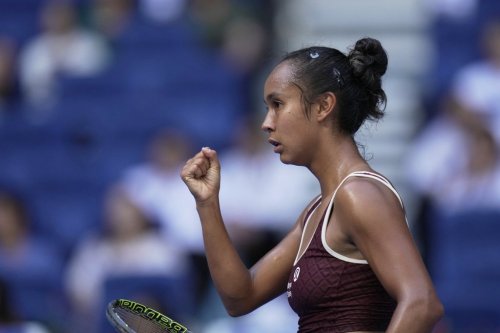 Leylah Fernandez of Canada reacts after scoring a point against Coco Gauff of the United States during a women's singles match of the China Open tennis tournament, at the National Tennis Center, in Beijing, China, Sunday, Sept. 28, 2025. (AP Photo/Mahesh Kumar A.)