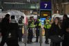 Police officers patrol the King's Cross train station, in London, Monday, Nov. 3, 2025. (AP Photo/Kin Cheung)