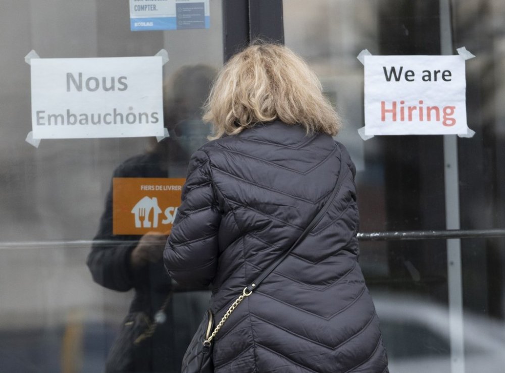 A customer enters a restaurant with help wanted signs in Laval, Que. Wednesday, Nov. 17, 2021 THE CANADIAN PRESS/Ryan Remiorz
