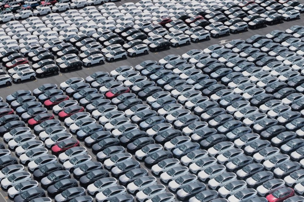 FILE -New cars for export wait for shipment at a port in Shanghai, China on May 11, 2025. (Chinatopix Via AP, File)
