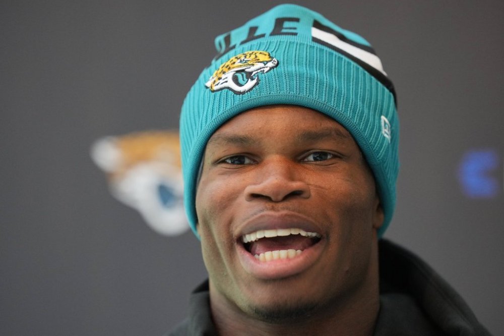 Jacksonville Jaguars wide receiver Travis Hunter speaks during a press conference at an NFL football practice at The Grove in Watford, England, Wednesday, Oct. 15, 2025. (AP Photo/Kin Cheung)