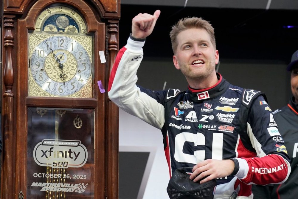 William Byron celebrates in Victory Lane after winning a NASCAR Cup series auto race in Martinsville, Va., Sunday, Oct. 26, 2025. (AP Photo/Chuck Burton)