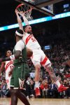 Toronto Raptors' Sandro Mamukelashvili (54) dunks as Milwaukee Bucks' Bobby Portis (9) looks on during first half NBA basketball action in Toronto on Tuesday, November 4, 2025. THE CANADIAN PRESS/Nathan Denette