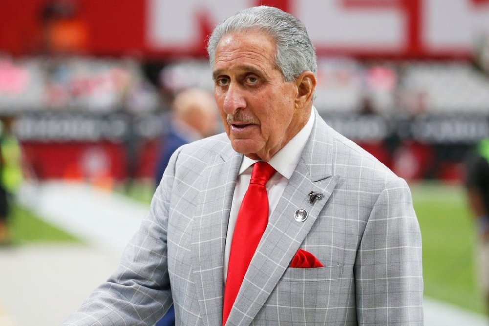 FILE - Atlanta Falcons owner Arthur Blank stands on the field prior to an NFL football game against the Arizona Cardinals, Oct. 13, 2019, in Glendale, Ariz. (AP Photo/Rick Scuteri, File)