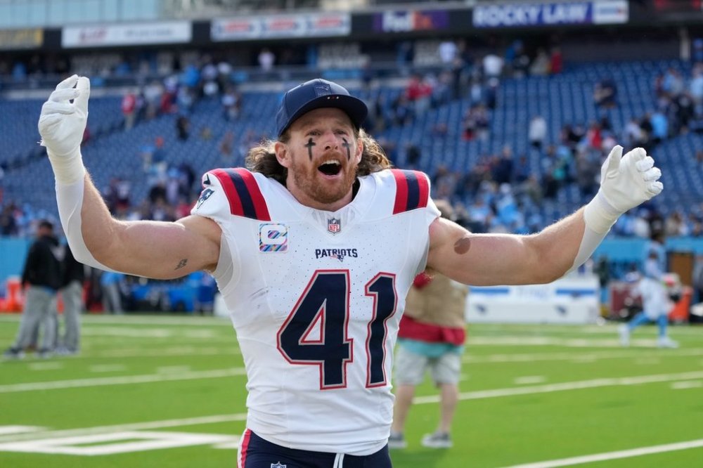 New England Patriots safety Brenden Schooler (41) celebrates following an NFL football game against the Tennessee Titans, Sunday, Oct. 19, 2025, in Nashville, Tenn. (AP Photo/George Walker IV)