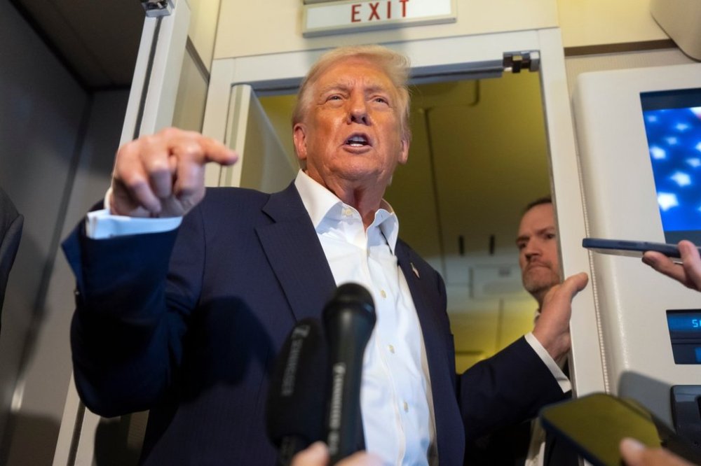 President Donald Trump speaks to reporters aboard Air Force One while traveling from Kuala Lumpur, Malaysia, to Tokyo, Japan, Monday, Oct. 27, 2025. (AP Photo/Mark Schiefelbein)