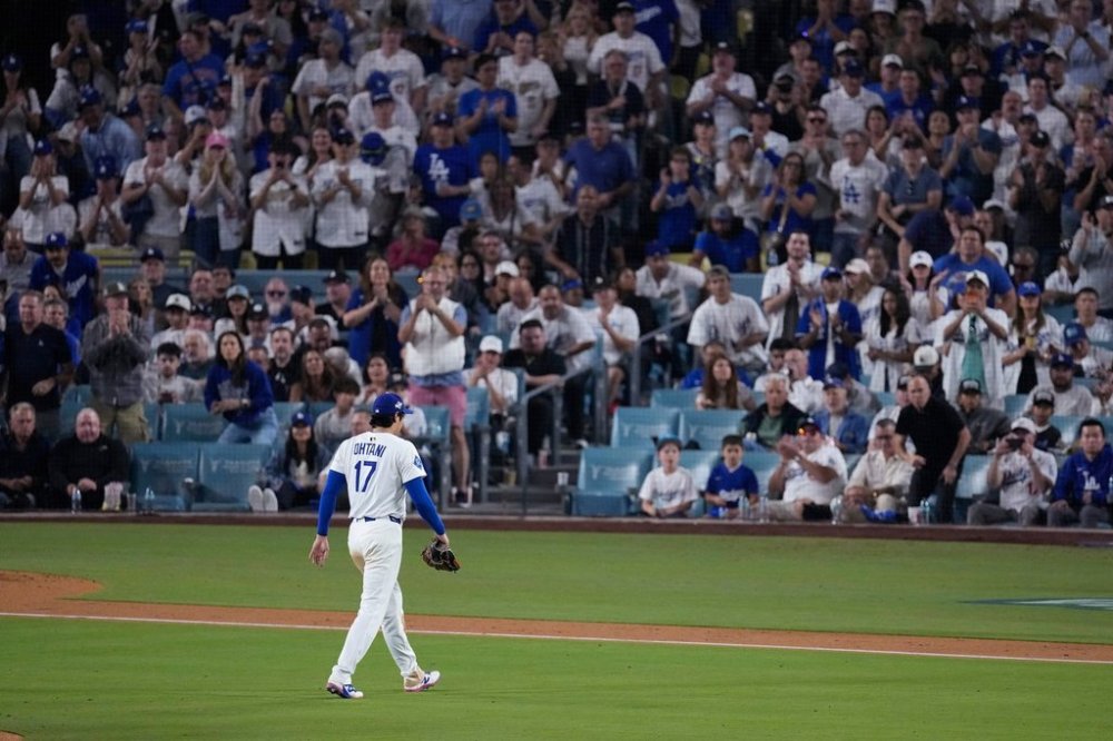 Los Angeles Dodgers' Shohei Ohtani leaves the game during the seventh inning in Game 4 of baseball's World Series against the Toronto Blue Jays, Tuesday, Oct. 28, 2025, in Los Angeles. (AP Photo/David J. Phillip)
