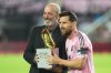MLS Commissioner Don Garber presents the Golden Boot award to Inter Miami forward Lionel Messi before match one of their MLS playoff opening round soccer match against the Nashville SC, Friday, Oct. 24, 2025, in Fort Lauderdale, Fla. (AP Photo/Marta Lavandier)