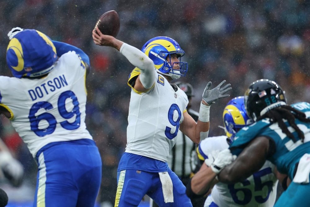 Los Angeles Rams quarterback Matthew Stafford (9) passes the ball during the first half of an NFL football game between the Los Angeles Rams and the Jacksonville Jaguars in London, Sunday, Oct. 19, 2025. (AP Photo/Ian Walton)