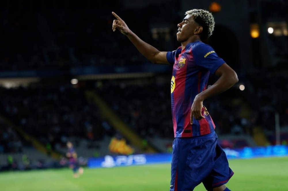Barcelona's Lamine Yamal celebrates after scoring his side's third goal during the Champions League opening phase soccer match between Barcelona and Olympiacos in Barcelona, Spain, Tuesday, Oct. 21, 2025. (AP Photo/Joan Monfort)