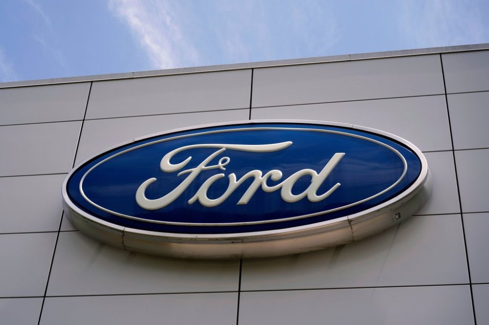 FILE - The Ford logo is seen above the entrance to the Ford Motor Company Kentucky Truck Plant, Wednesday, April 30, 2025, in Louisville, Ky. (AP Photo/Carolyn Kaster, File)