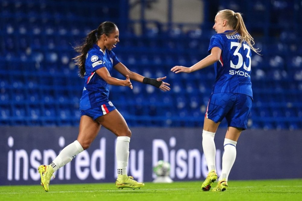 Chelsea's Alyssa Thompson, left, celebrates scoring their side's third goal of the game during the Women's Champions League soccer match between Chelsea and Paris FC at Stamford Bridge, London, Wednesday, Oct. 15, 2025. (John Walton/PA via AP)