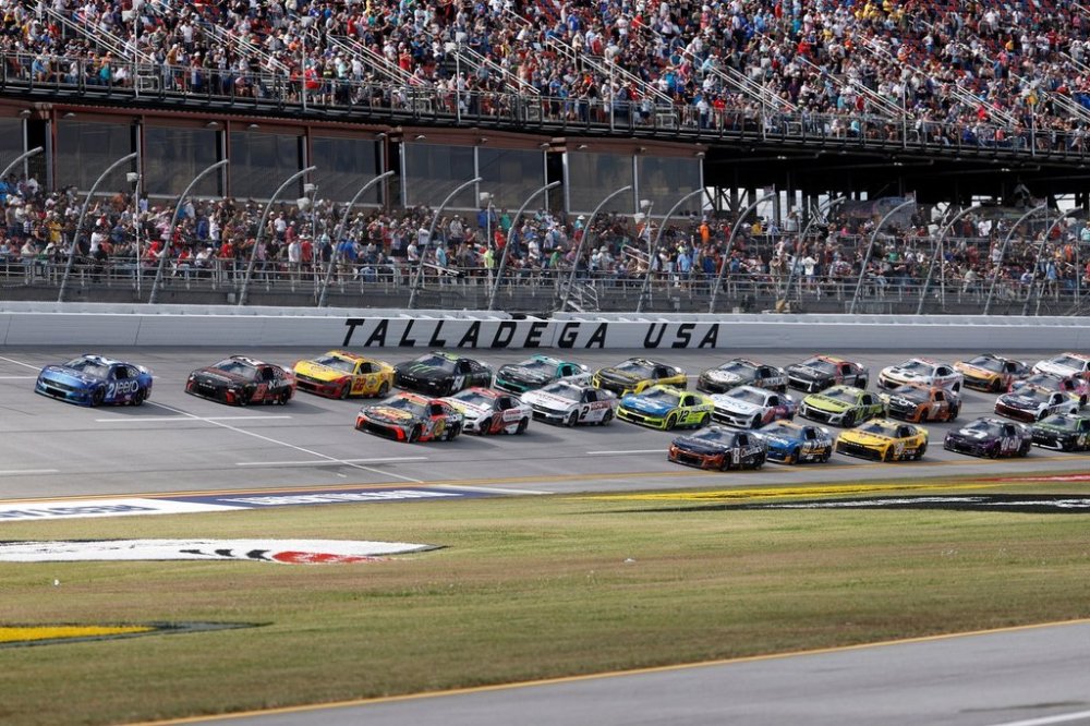 Josh Berry (21) leads the pack during a NASCAR Cup Series auto race at Talladega Superspeedway, Sunday, Oct. 19, 2025, in Talladega, Ala. (AP Photo/Butch Dill)