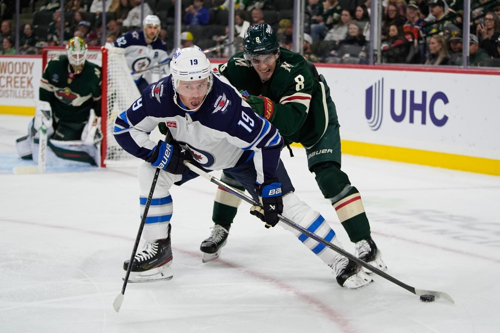 ABBIE PARR / ASSOCIATED PRESS FILES
Toews (19) controls the puck as Minnesota Wild defenceman Zeev Buium (8) defends during the Sept. 30 preseason game in St. Paul, Minn.