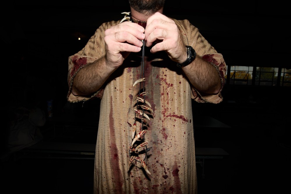 Nathan Richart, of Westland, gets ready for his performance at the Erebus Haunted House, Oct. 2, 2025, in Pontiac, Mich. (AP Photo/Ryan Sun)