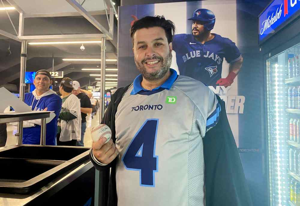 Michael Angeletti poses for a photo in Toronto on Monday, Oct. 20, 2025. Angeletti caught George Springer's home run ball in game 7 of the ALCS against the Seattle Mariners. THE CANADIAN PRESS/Rianna Lim
