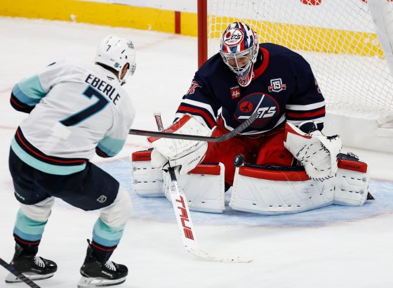 Winnipeg Jets goaltender Connor Hellebuyck (37) saves a third-period shot from Seattle Kraken's Jordan Eberle (7) during the Oct. 23 game. (John Woods / The Canadian Press files)