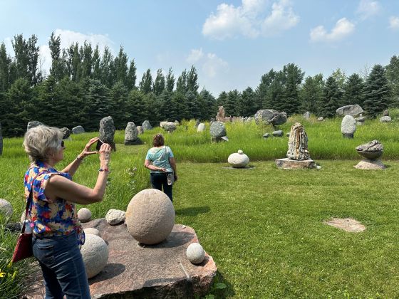 Gardening enthusiasts tour Todd Braun's outdoor geological museum in Altona (Brenda Bacon photo)