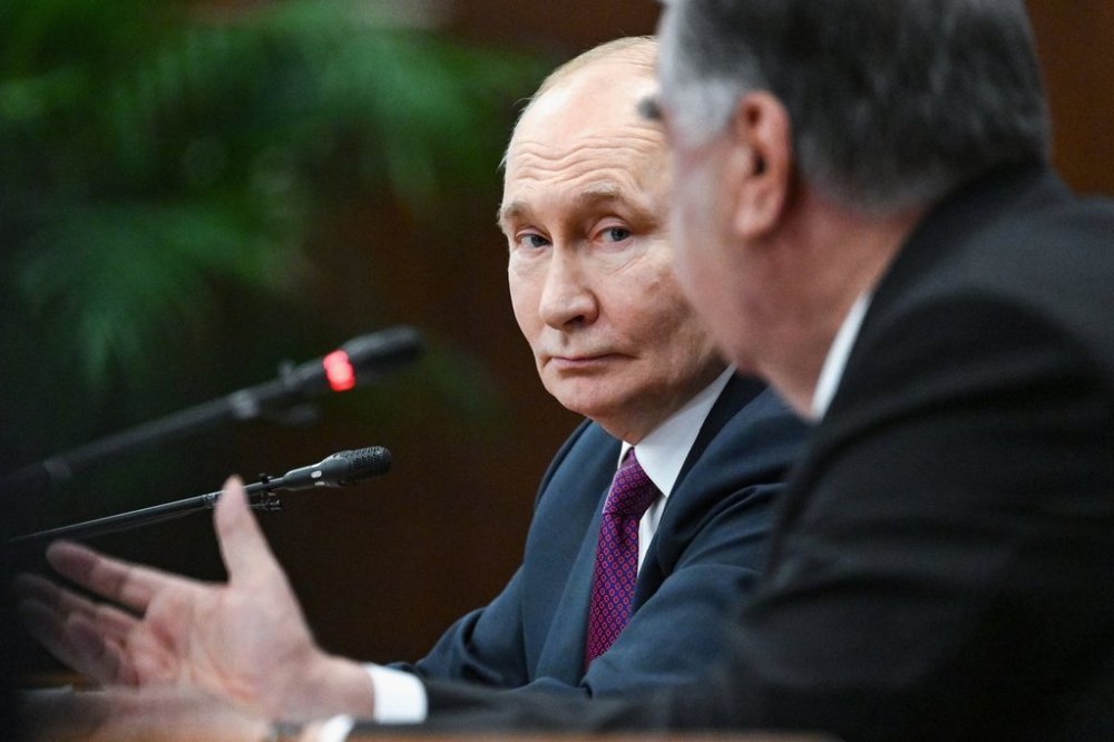 Russian President Vladimir Putin, left, and Tajik President Emomali Rahmon talk to each other attending a signing ceremony following their talks at the Palace of the Nation in Dushanbe, Tajikistan, on Thursday, Oct. 9, 2025. (Kristina Kormilitsyna, Sputnik, Kremlin Pool Photo via AP)