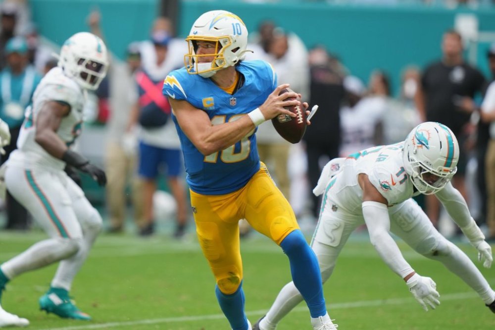 Los Angeles Chargers quarterback Justin Herbert scrambles during the second half of an NFL football game against the Miami Dolphins Sunday, Oct. 12, 2025, in Miami Gardens, Fla. (AP Photo/Lynne Sladky)