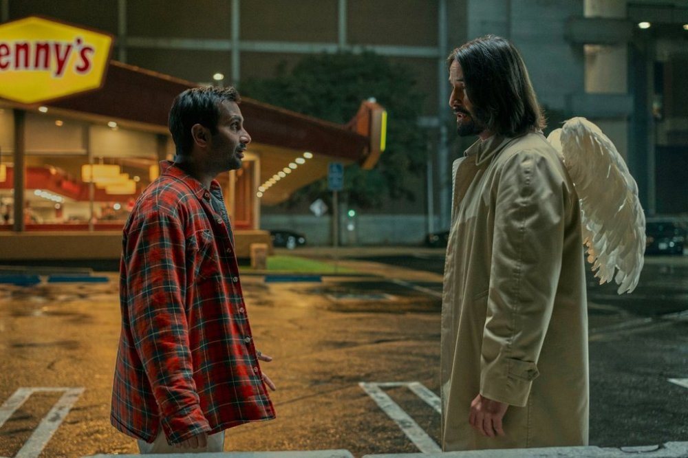This image released by Lionsgate shows Aziz Ansari, left, and Keanu Reeves in a scene from