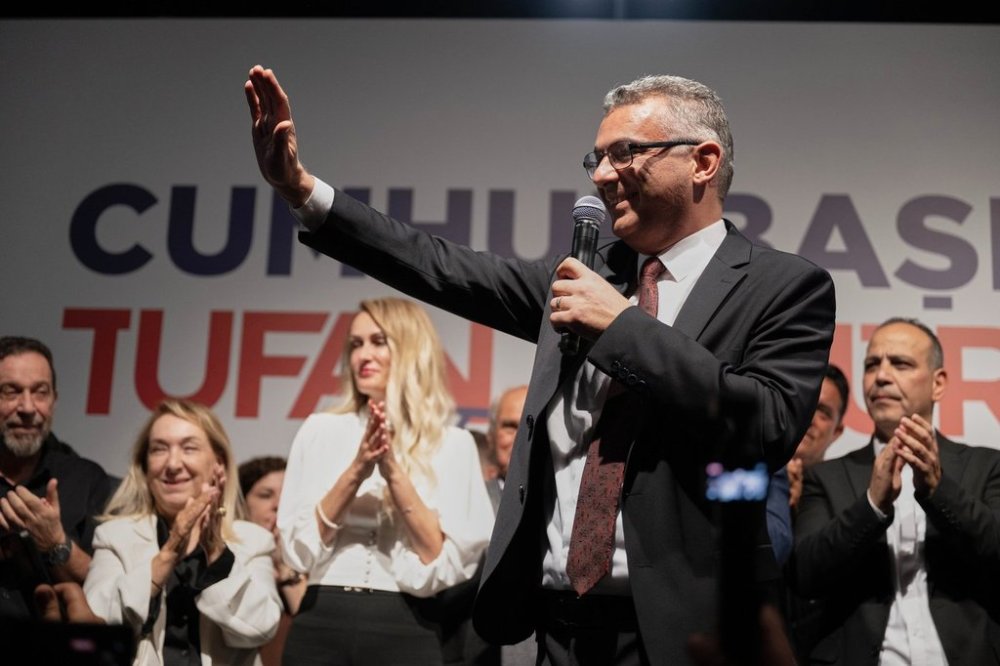 Turkish Cypriot newly elected leader Tufan Erhurman waves to supporters after winning the leadership election in the Turkish occupied northern part of the divided capital Nicosia, Cyprus, Sunday, Oct. 19, 2025. (AP Photo/Nedim Enginsoy)