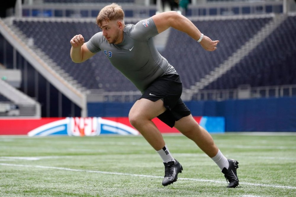 FILE - Offensive lineman Leander Wiegand, of Germany, participates in a drill at the NFL international scouting combine at Tottenham Hotspur Stadium in London, Tuesday, Oct. 4, 2022. (AP Photo/Steve Luciano, File)