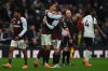 Aston Villa's Emiliano Buendia, right and teammate Aston Villa's Donyell Malen embrace at the end of the English Premier League soccer match between Tottenham Hotspur and Aston Villa in London, Sunday, Oct. 19, 2025. (AP Photo/Joanna Chan)