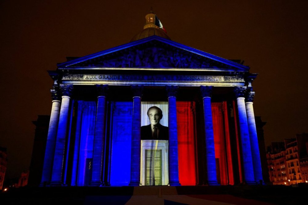 The Pantheon monument is illuminated during the induction ceremony of former French Justice Minister Robert Badinter, a revered rights defender who spearheaded France's drive to end the death penalty, Thursday, Oct. 9, 2025 in Paris. (Stephanie Lecocq/Pool photo via AP)