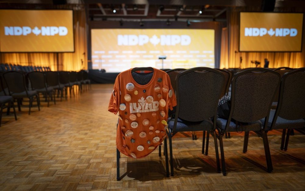 An NDP shirt with various campaign pins is shown at the NDP Convention in Hamilton, Ont. on Friday, October 13, 2023. THE CANADIAN PRESS/Peter Power