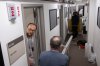 Members of the media pack up their belongings in the press area of the Pentagon, Wednesday, Oct. 15, 2025 in Washington. (AP Photo/Kevin Wolf)