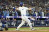 Toronto Blue Jays' Addison Barger (47) watches the ball after hitting a grand slam against the Los Angeles Dodgers during sixth inning Game 1 World Series playoff MLB baseball action in Toronto on Friday, Oct. 24, 2025. THE CANADIAN PRESS/Frank Gunn