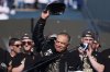 Los Angeles Dodgers manager Dave Roberts tips his cap during a celebration of the baseball team's World Series win at Dodger Stadium on Monday, Nov. 3, 2025, in Los Angeles. (AP Photo/Gregory Bull)