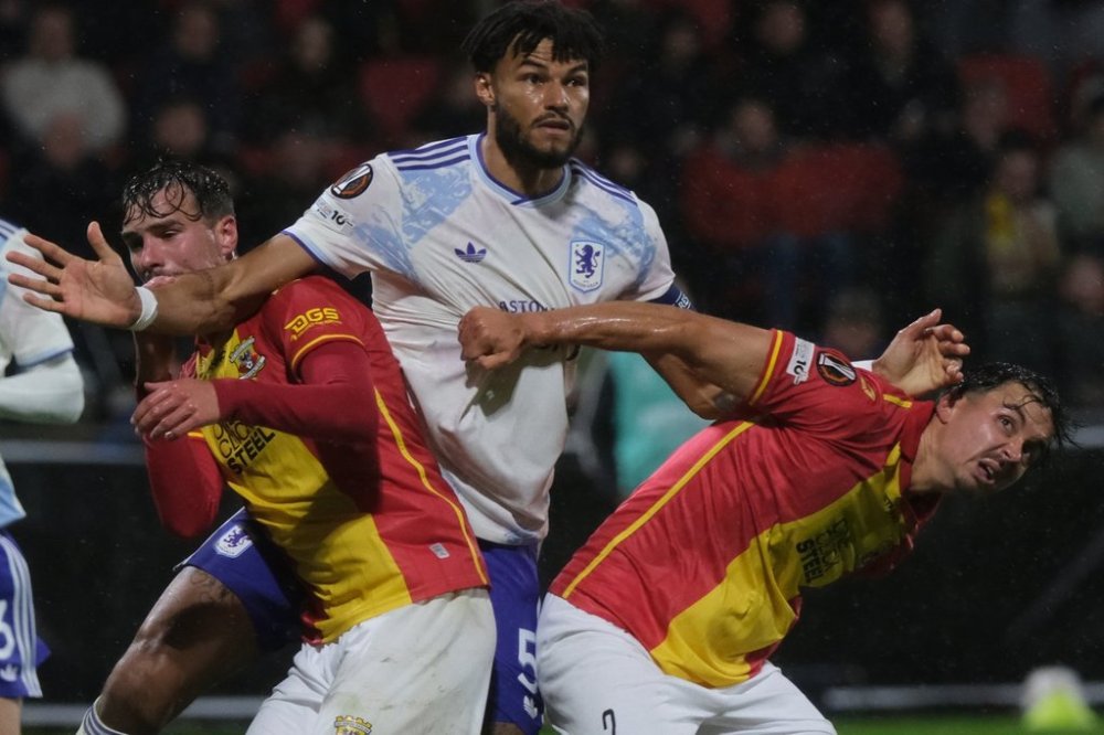 Aston Villa's Tyrone Mings pushes Go Ahead Eagles' Mats Deijl during the Europa League soccer match between Go Ahead Eagles and Aston Villa in Deventer, Netherlands, Thursday, Oct. 23, 2025. (AP Photo/Patrick Post)