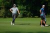 Rory McIlroy of Northern Ireland, left, waits for his turn to hit the ball during the DP World Tour Championship golf tournament in New Delhi, India, Thursday, Oct. 16, 2025. (AP Photo/Manish Swarup)