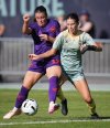 Calgary Wild's Christie Gray, left, and Vancouver Rise's Holly Ward vie for the ball during the second half of an NSL soccer match, in Burnaby, B.C., on Saturday, May 24, 2025. THE CANADIAN PRESS/Darryl Dyck