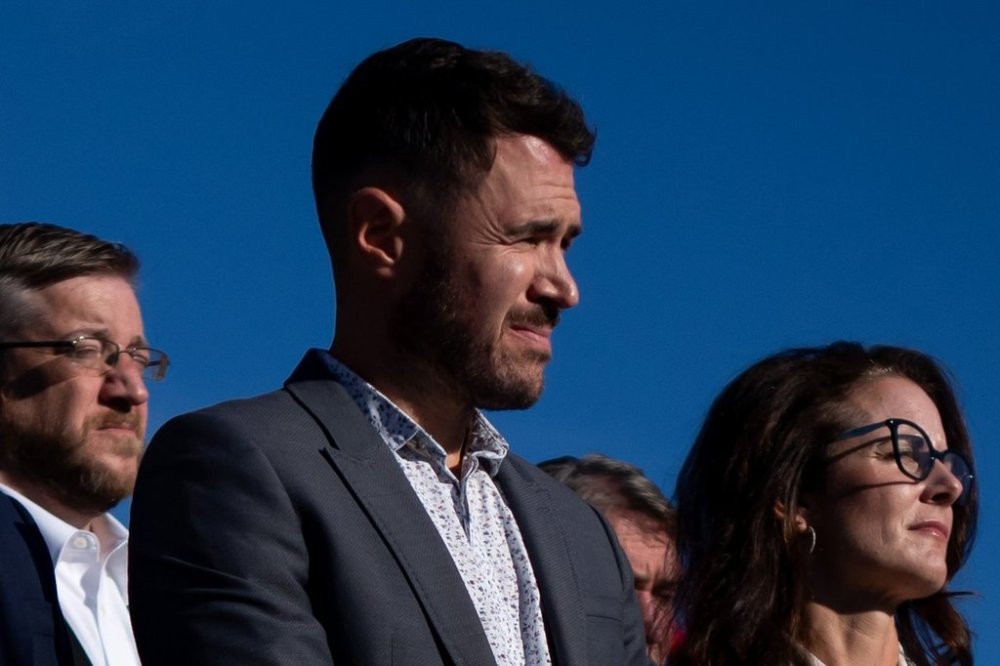 Port Coquitlam Mayor Brad West, centre, flanked by District of North Vancouver Mayor Mike Little, left, and City of Pitt Meadows Mayor Nicole MacDonald looks on during a news conference in Vancouver, B.C., Monday, Sept. 16, 2024. THE CANADIAN PRESS/Ethan Cairns