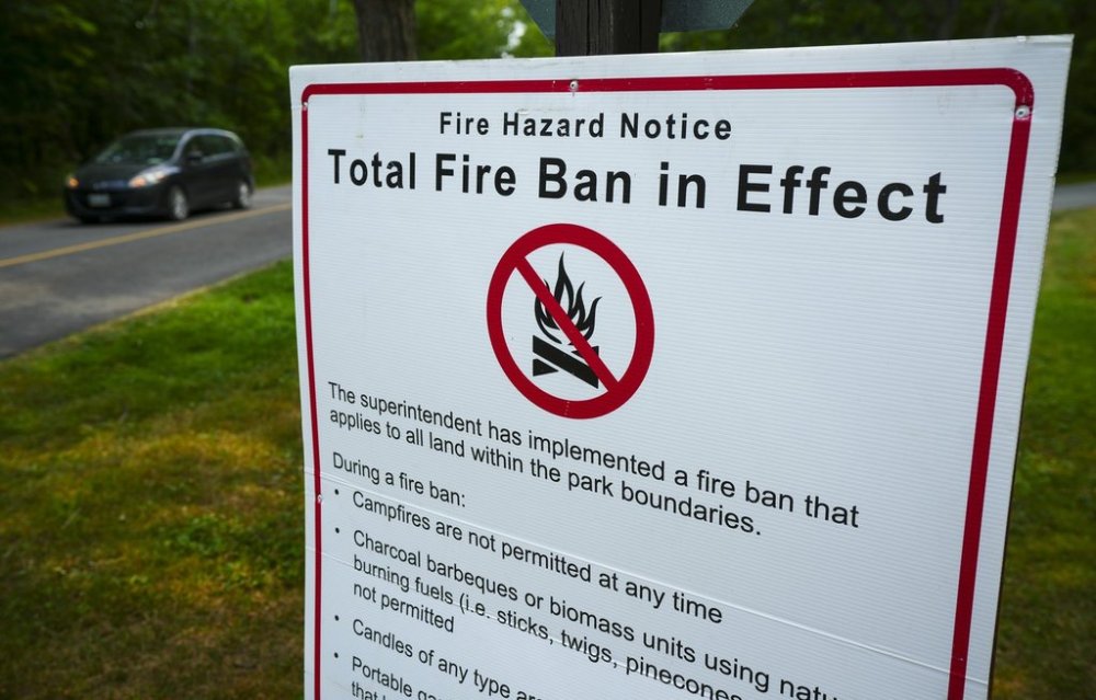 A fire ban sign is displayed at Fitzroy Provincial Park on the Ottawa River, in Fitzroy Harbour, Ont., Tuesday, Aug. 12, 2025. THE CANADIAN PRESS/Sean Kilpatrick