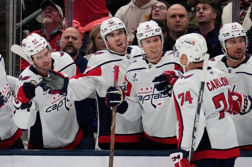 Washington Capitals defenseman John Carlson (74) is congratulated by teammates after scoring in the second period of an NHL hockey game against the Columbus Blue Jackets Friday, Oct. 24, 2025, in Columbus, Ohio. (AP Photo/Sue Ogrocki)