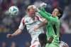 Vancouver Whitecaps' goalkeeper Yohei Takaoka, right, punches the ball away from FC Dallas' Samuel Sarver during the first half of an MLS soccer match, in Vancouver, on Saturday, October 18, 2025. THE CANADIAN PRESS/Darryl Dyck
