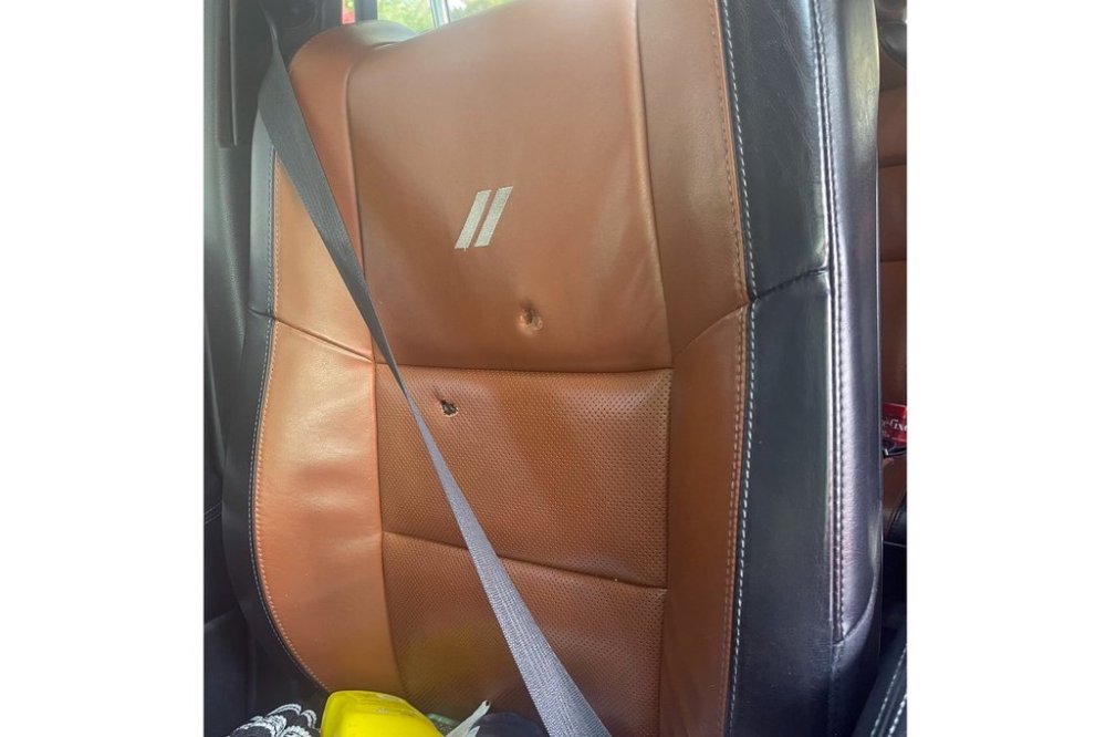 This image provided by Elizabeth Paige White shows bullet holes in a seat in a vehicle of Phillip M. Brown after a Homeland Security Investigations agent fired shots Oct. 17, 2025, in Washington, during a traffic stop. (Elizabeth Paige White via AP)