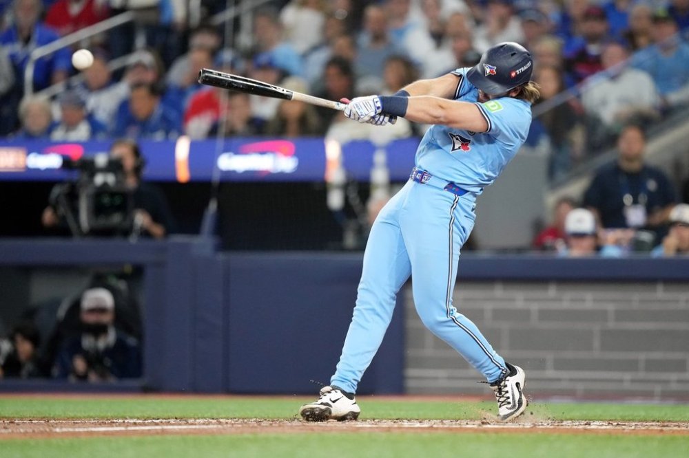 Blue Jays outfielder Addison Barger (47) hits a double against the Los Angeles Dodgers during the third inning of Game 6 of the World Series in Toronto on Oct. 31, 2025. THE CANADIAN PRESS/Nathan Denette