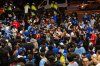 Toronto Blue Jays fans celebrate after the team beat the Seattle Mariners to win the American League Championship Series, in Toronto, Tuesday, Oct. 21, 2025. THE CANADIAN PRESS/Laura Proctor