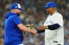 Former Blue Jays manager Cito Gaston, right, shakes hands with current skipper John Schneider after throwing the ceremonial first pitch before Game 1 of Major League Baseball's World Series between the Blue Jays and Los Angeles Dodgers in Toronto on Oct. 24, 2025. THE CANADIAN PRESS/Frank Gunn