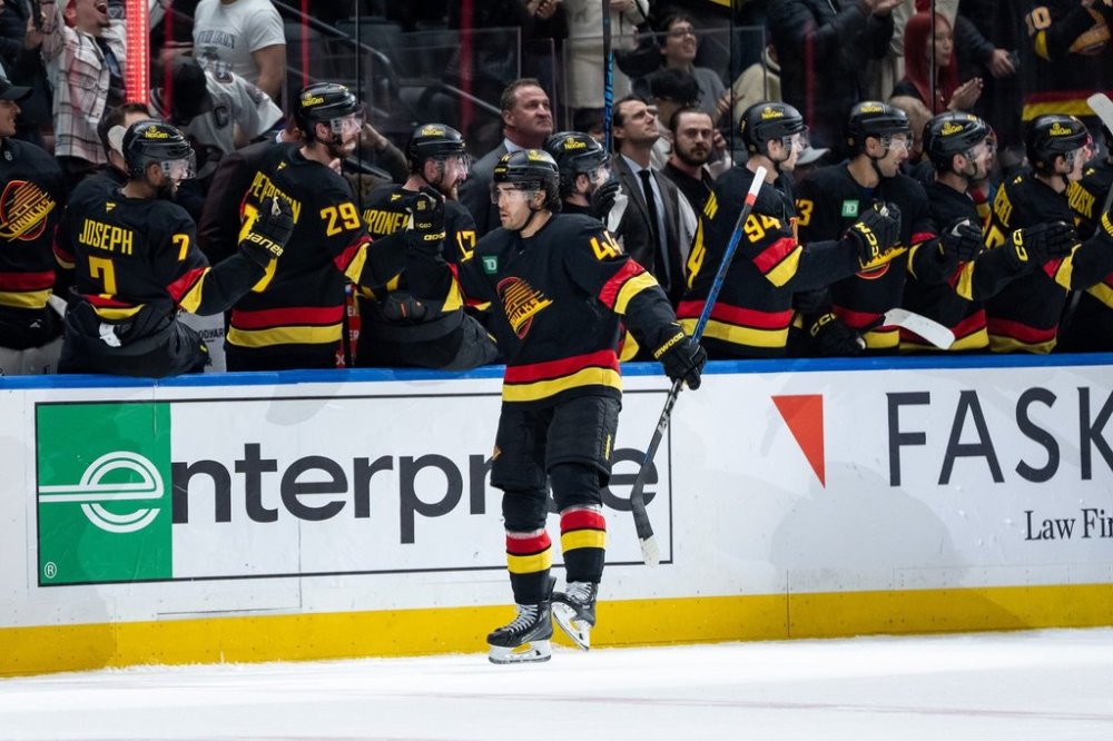 Vancouver Canucks' Kiefer Sherwood (44) celebrates his goal against the Edmonton Oilers with teammates during second period NHL hockey action in Vancouver, B.C., Sunday, Oct. 26, 2025. THE CANADIAN PRESS/Ethan Cairns