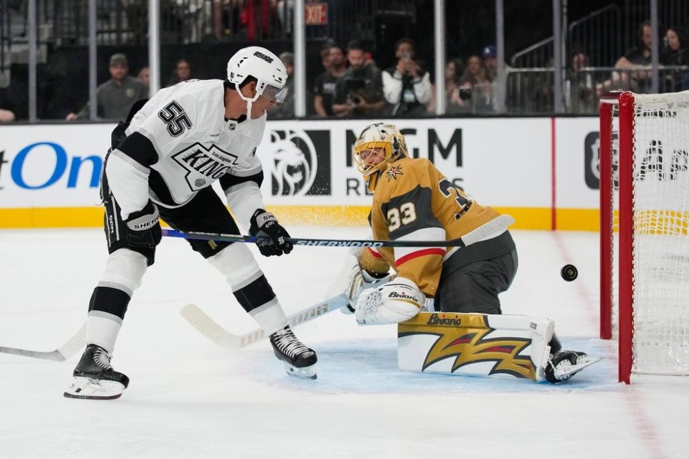Los Angeles Kings right wing Quinton Byfield (55) scores against Vegas Golden Knights goaltender Adin Hill (33) during the first period of an NHL hockey game Wednesday, Oct. 8, 2025, in Las Vegas. (AP Photo/John Locher)