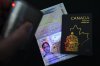 The new Canadian passport is unveiled at an event at the Ottawa International Airport in Ottawa on Wednesday, May 10, 2023. THE CANADIAN PRESS/Sean Kilpatrick
