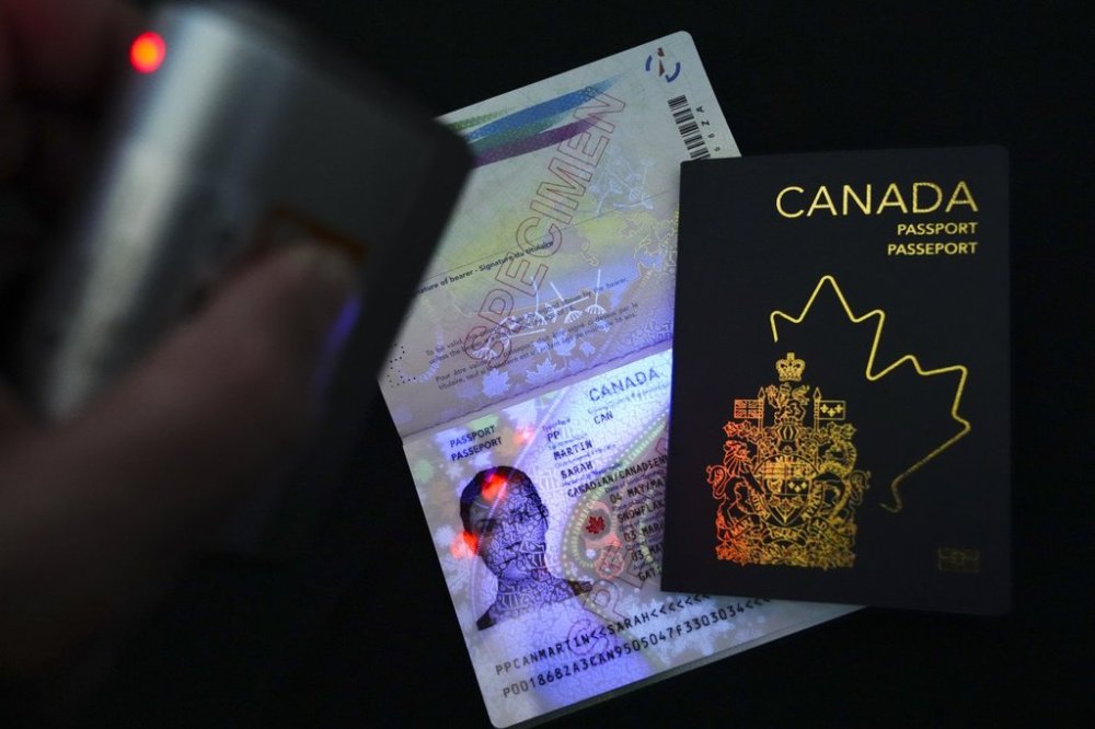 The new Canadian passport is unveiled at an event at the Ottawa International Airport in Ottawa on Wednesday, May 10, 2023. THE CANADIAN PRESS/Sean Kilpatrick