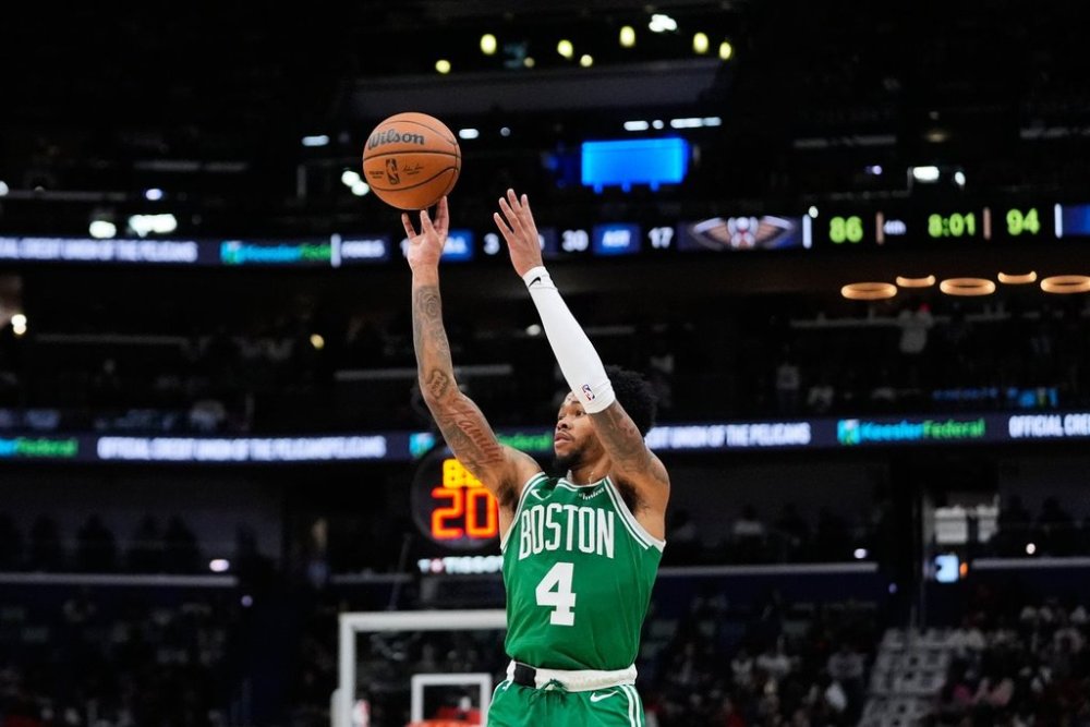 Boston Celtics guard Anfernee Simons (4) shoots a 3-point shot against the New Orleans Pelicans in the second half of an NBA basketball game, Monday, Oct. 27, 2025, in New Orleans. (AP Photo/Gerald Herbert)